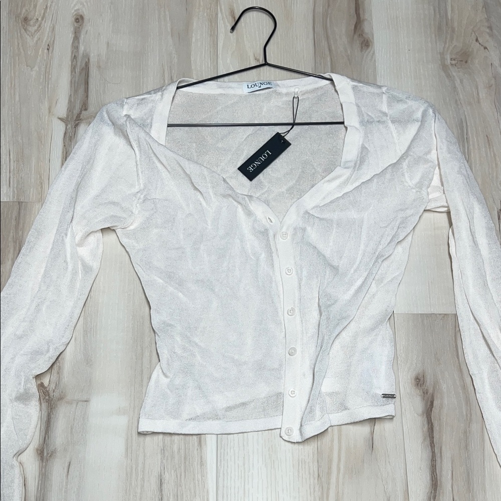 See through white cardigan size medium, never worn. Brand is lounge.